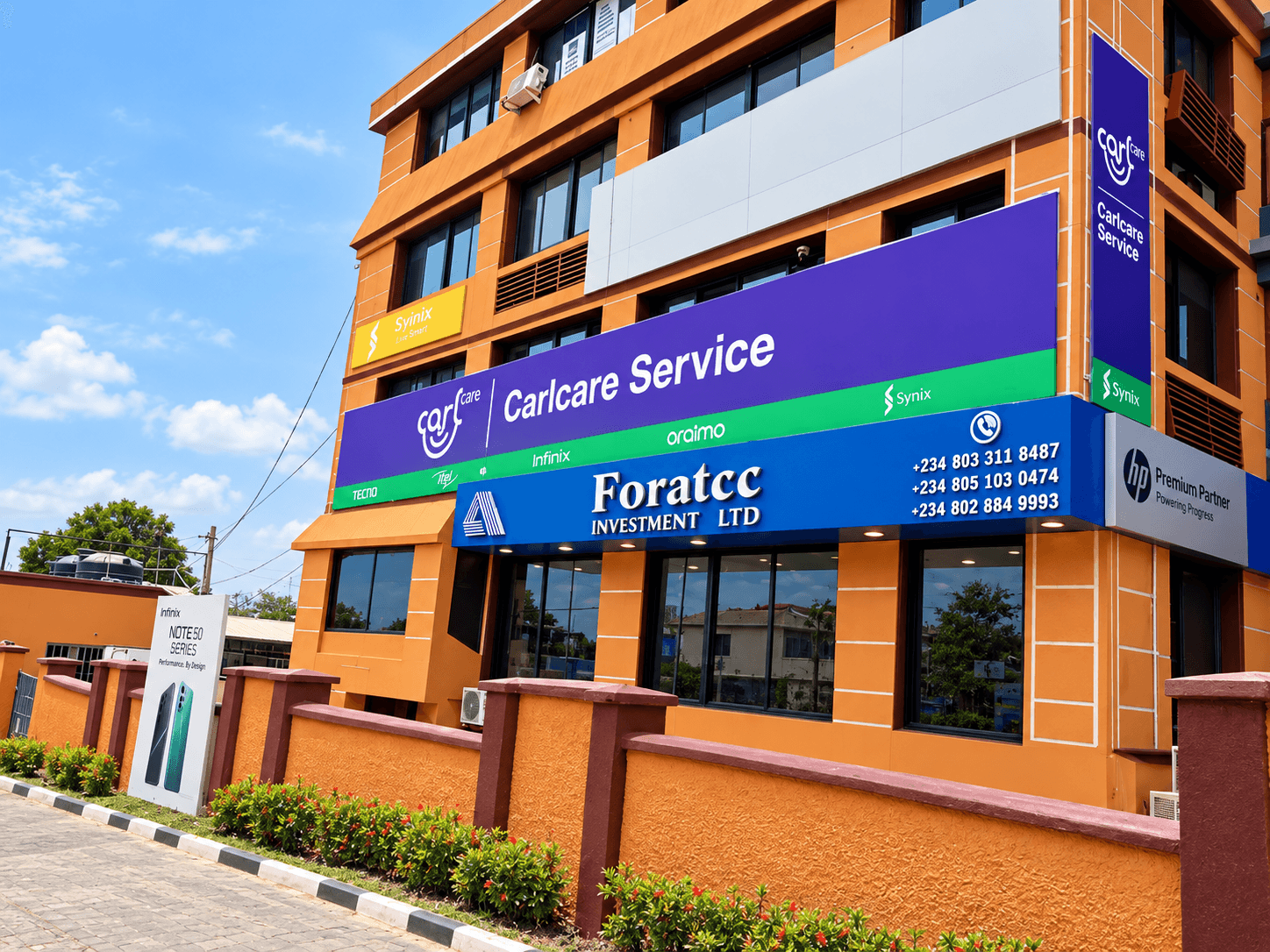 Carlcare commercial façade branding with Infinix family branding